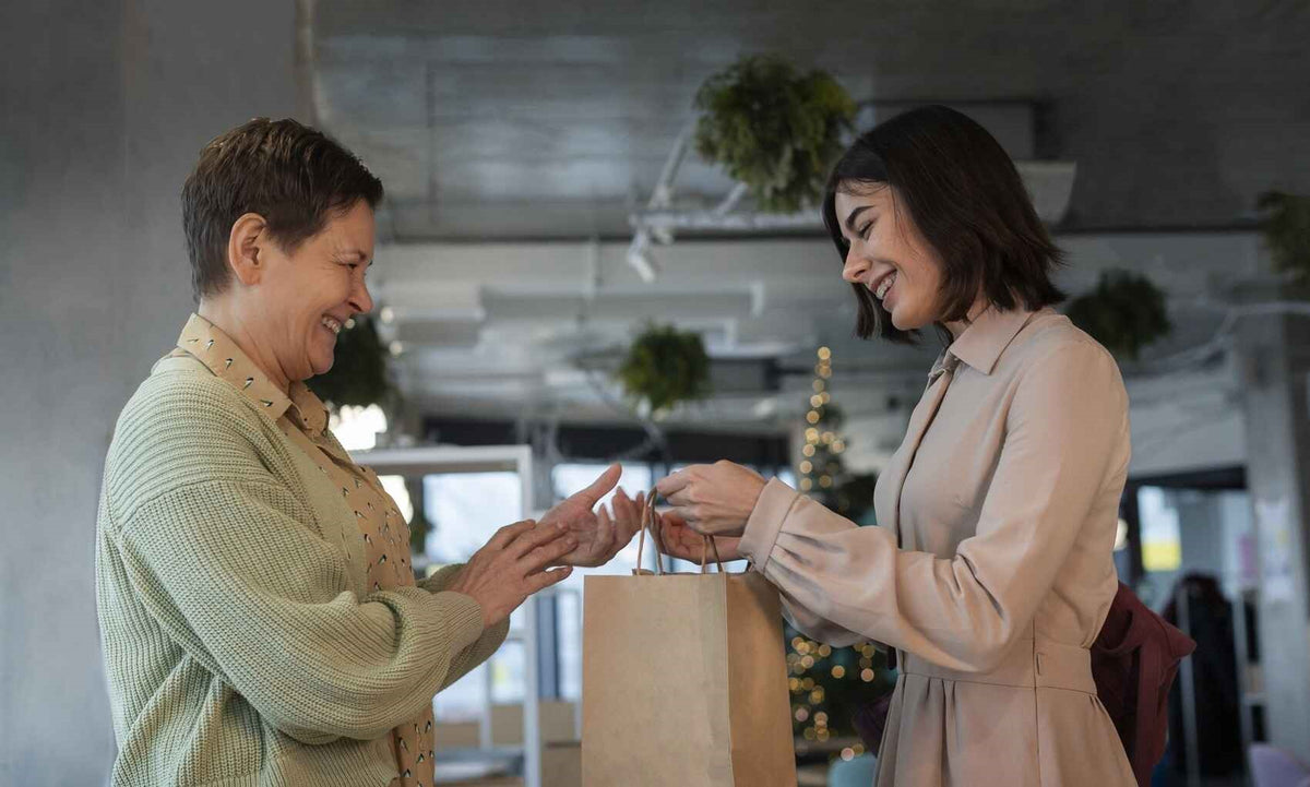 A delivery being handed to a smiling recipient