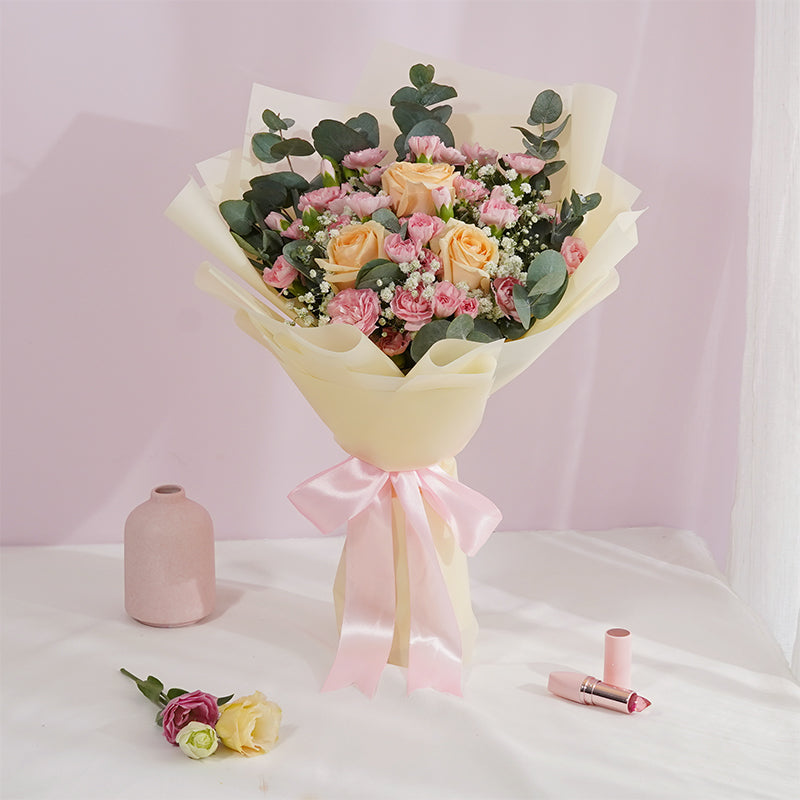 Sweet Kisses bouquet of pastel roses and eustoma wrapped in cream paper